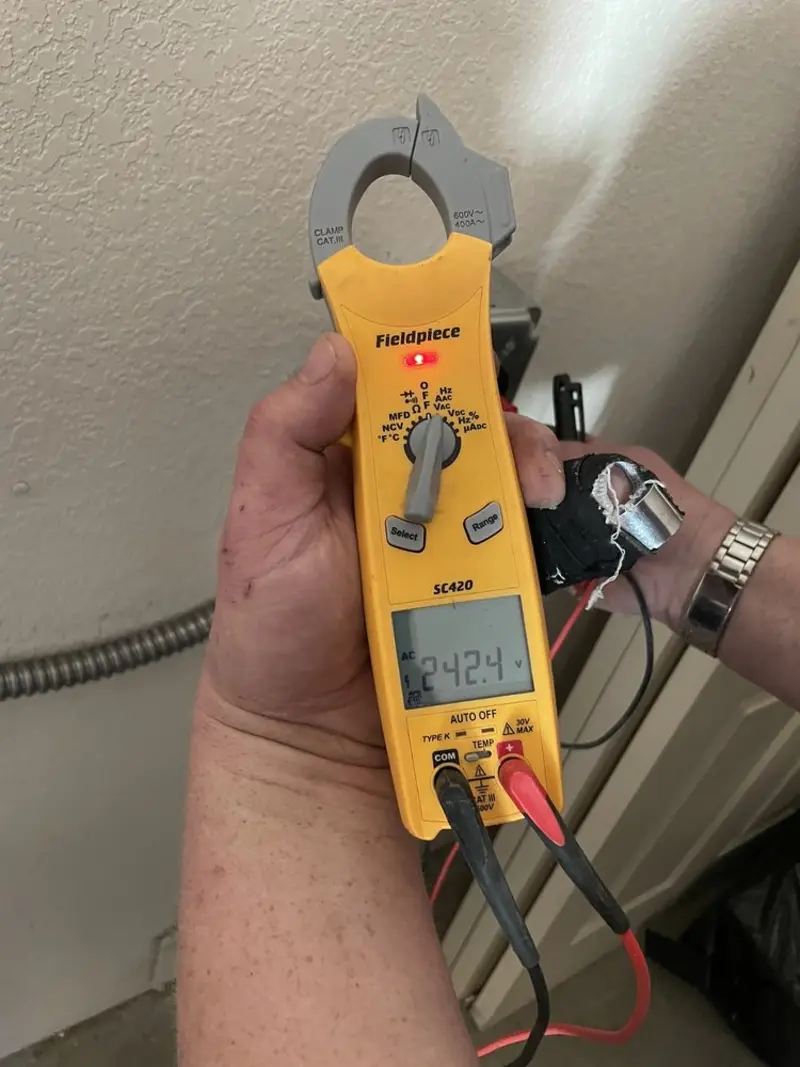 Voltage testing with clamp meter during Whole House Surge Protector in Clearfield
